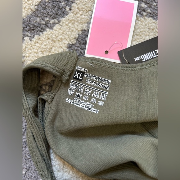 FREE w/ PURCHASE NWT PrettyLittleThing Olive Seamless Strappy Gym Unitard - Picture 7 of 8